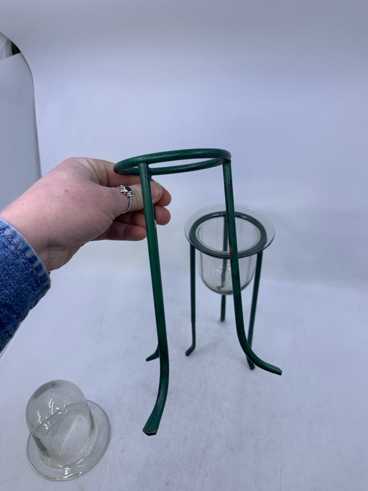 2 GREEN METAL STANDS W/ GLASS INSERTS.