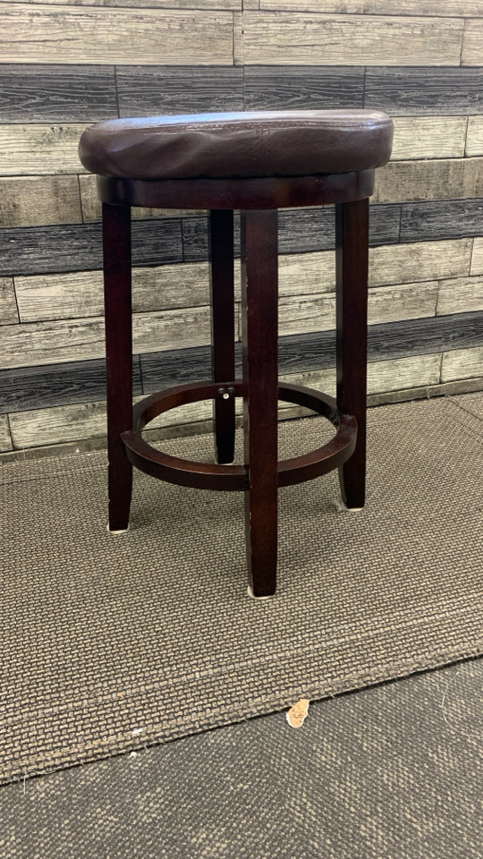 DARK WOOD ROUND STOOL W FAUX LEATHER SEAT.