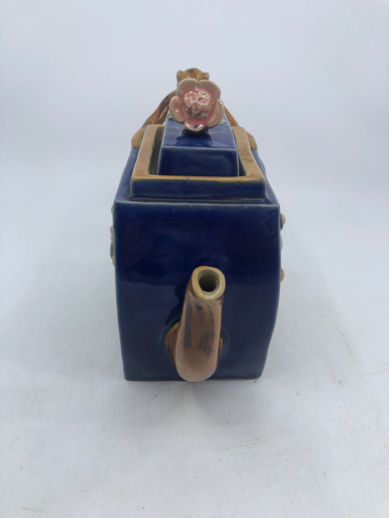 MAJOLICA STYLE TEAPOT W/ EMBOSSED PINK FLOWERS MONKEY AS HANDLE NUMBERED.