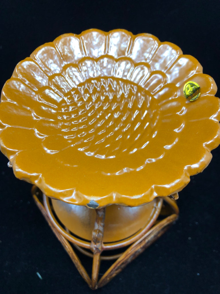 RUST COLORED METAL ORNATE PILLAR CANDLE HOLDER.