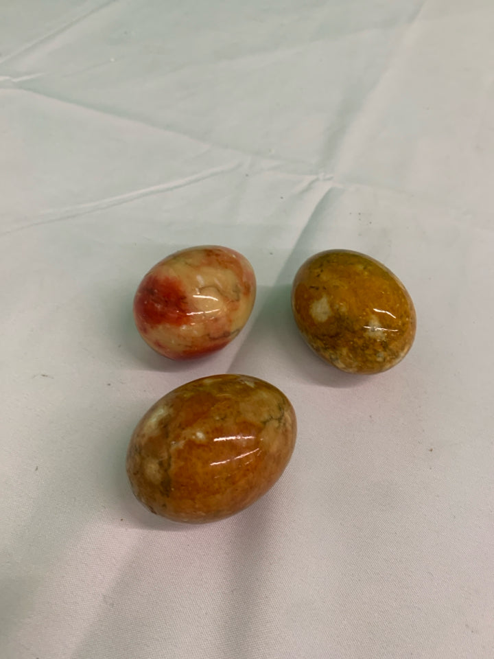 3 BROWN GLASS MARBLE EGGS.
