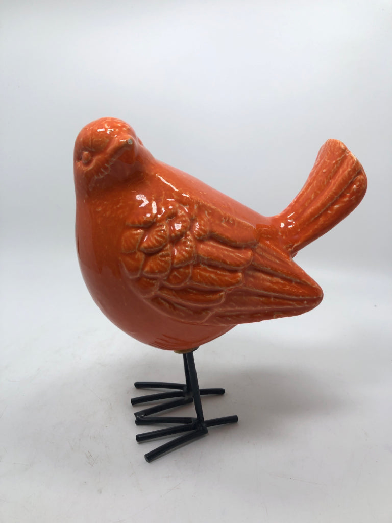 ORANGE CERAMIC BIRD W/METAL LEGS.