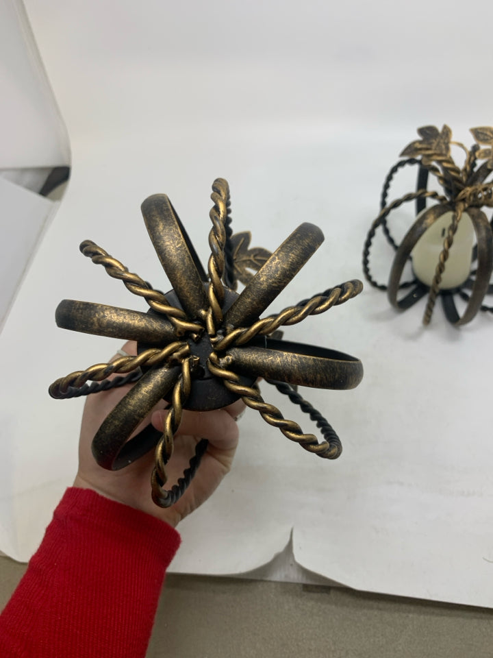 2 METAL PUMPKIN CAGE TEALIGHT HOLDERS BRONZE W/ FAUX CANDLES.