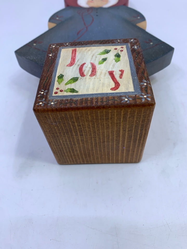WOOD GIRL IN BLUE DRESS ON "JOY" BLOCK.