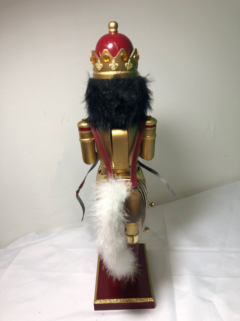RED AND GOLD NUT CRACKER .