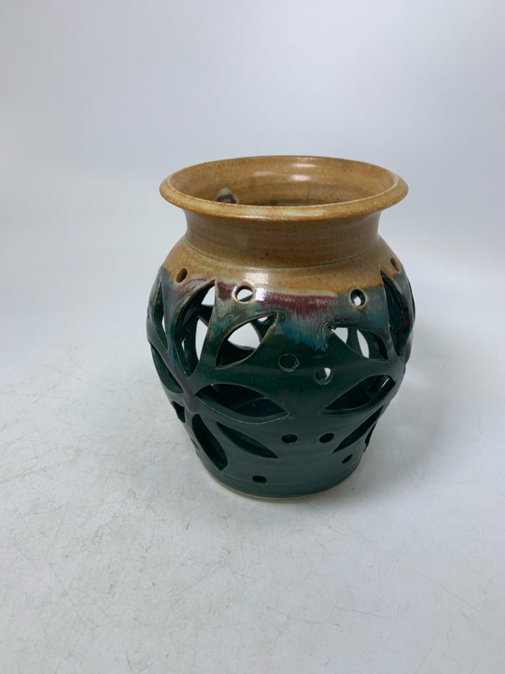 DARK GREEN PIERCED POTTERY CANDEL HOLDER/VASE W/ TAN TOP.