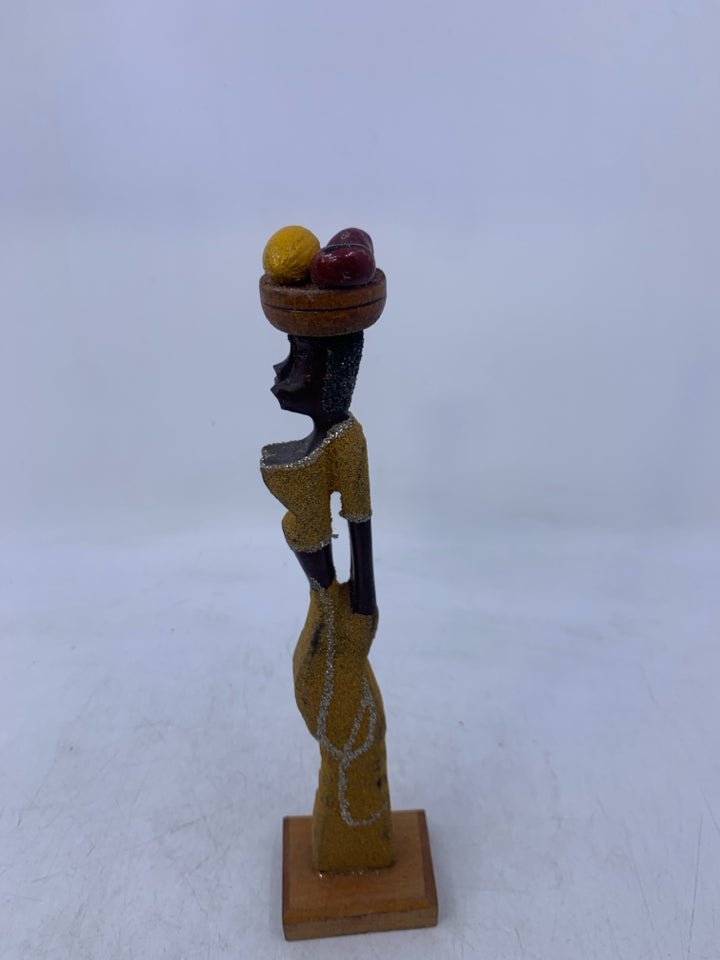 CARVED WOMAN CARRYING FRUIT ON HEAD.