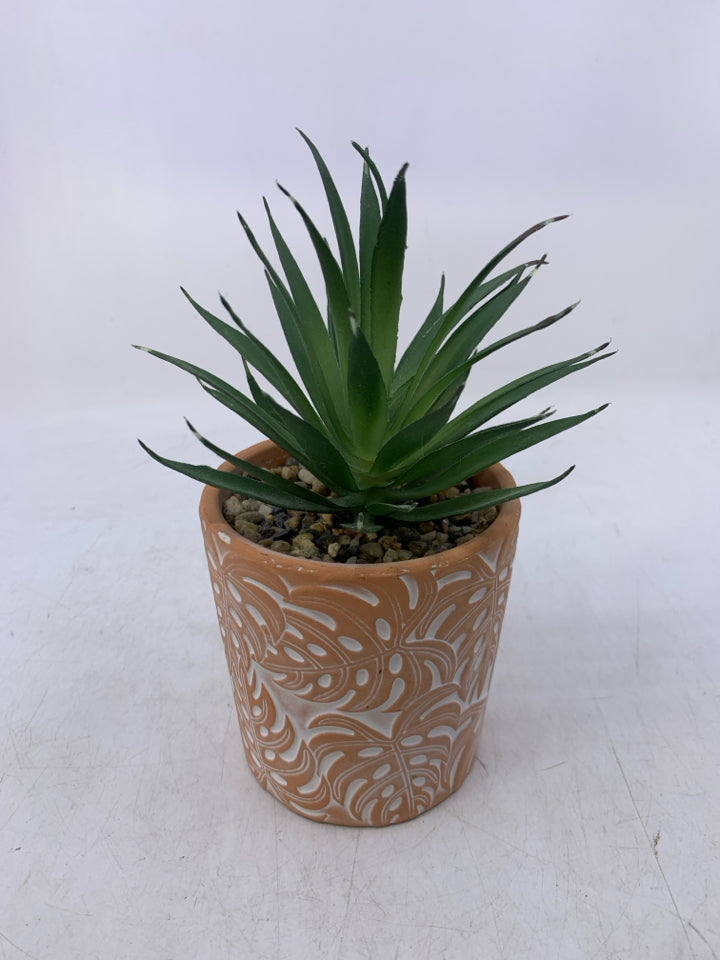 TERA COTTA PLANTER W/ SKINNY LEAVES + ROCK FILLER.