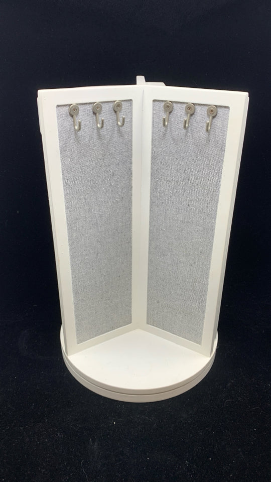 ROTATING GRAY FABRIC JEWELRY HOLDER.