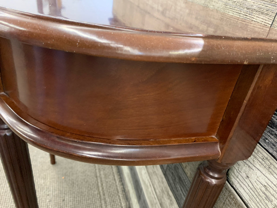 MAROON HALF MOON TABLE W 1 DRAWER.