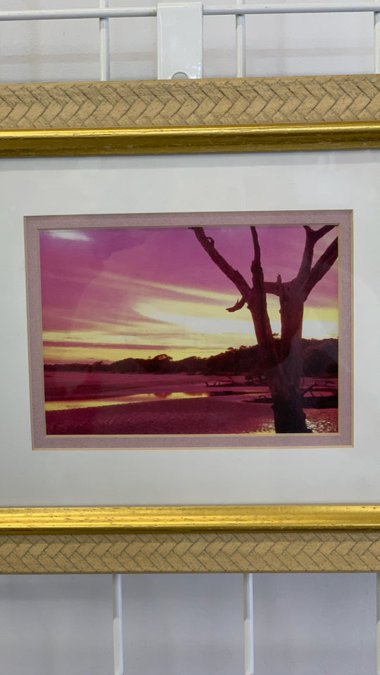 SUNSET PHOTO IN GOLD FRAME.