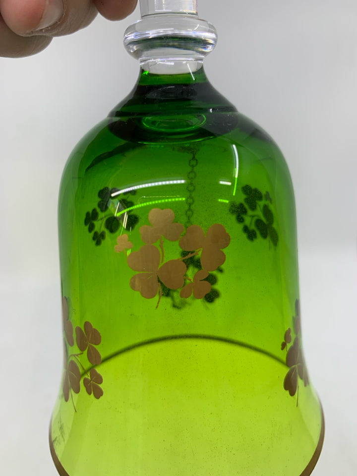 GREEN GLASS BELL W/ GOLD PAINTED SHAM ROCKS.