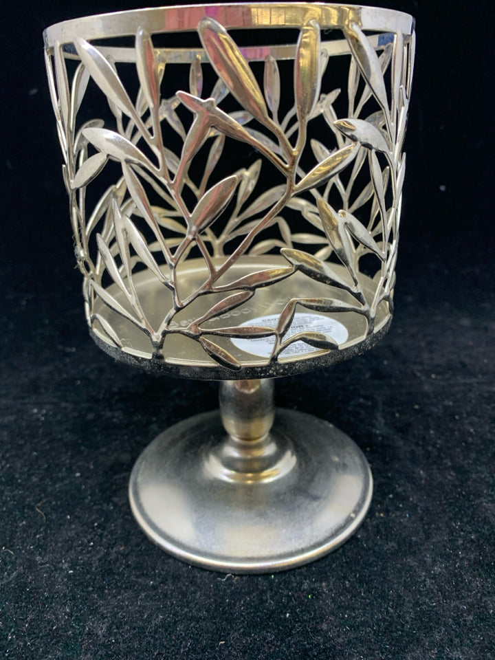 FOOTED SILVER METAL CANDLE SLEEVE LEAF DETAIL.