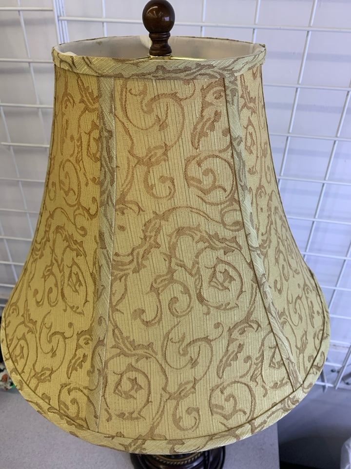 BROWN WOOD GOLD SWIRL TABLE LAMP WITH GOLD SWIRL SHADE.