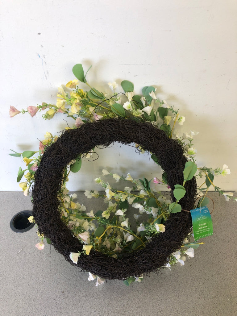 WHITE SMALL FLOWERS W/ GREEN LEAVES WREATH.