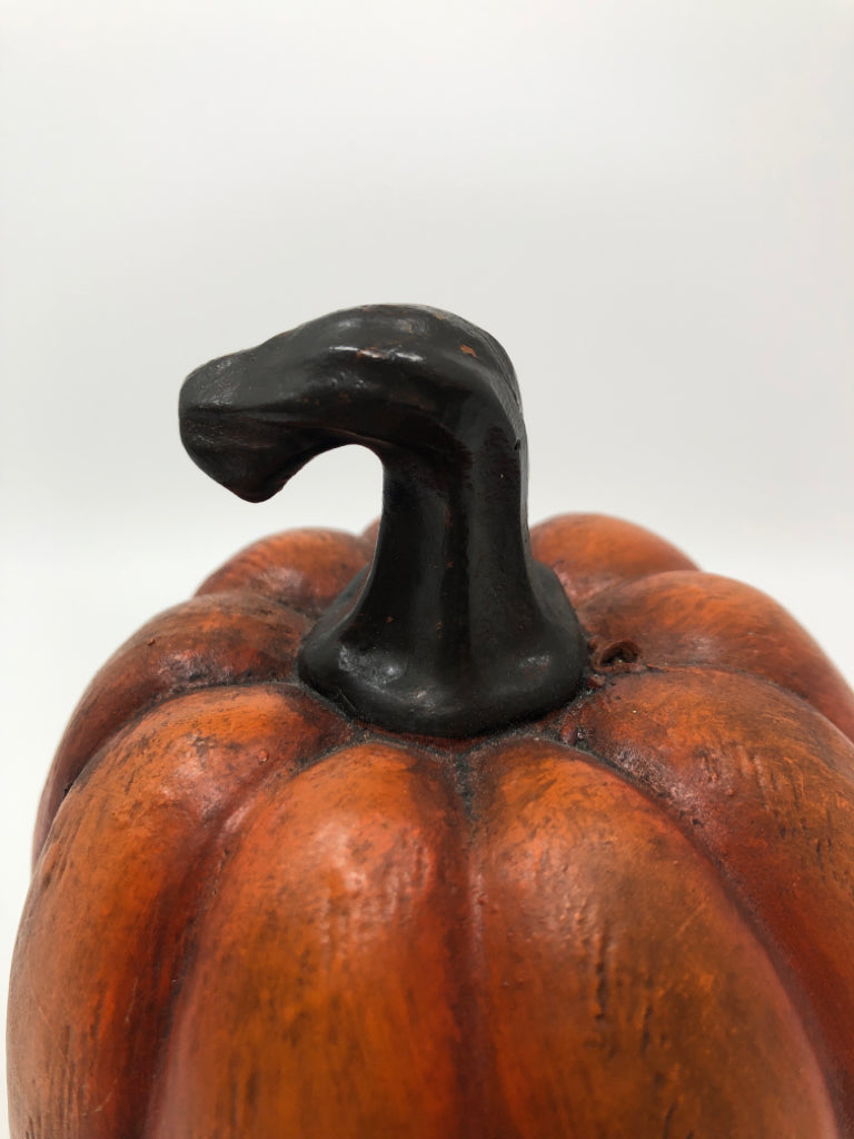 ORANGE PAINTED RESIN PUMPKIN.