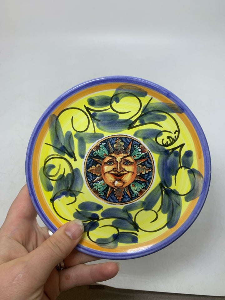 SMALL CERAMIC PLATE W/ DETAILED SUN IN CENTER.