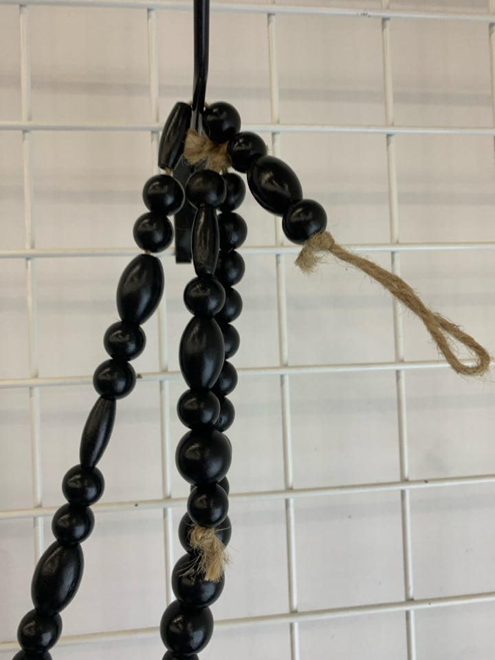BLACK WOODEN BEADED GARLAND.