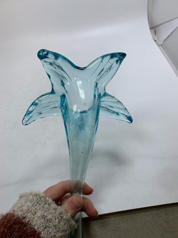 BLOWN GLASS LIGHT BLUE FLOWER LAYING FLAT.