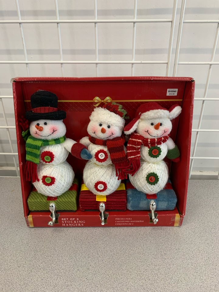NIP 3 PC SNOWMAN STOCKING HANGERS.