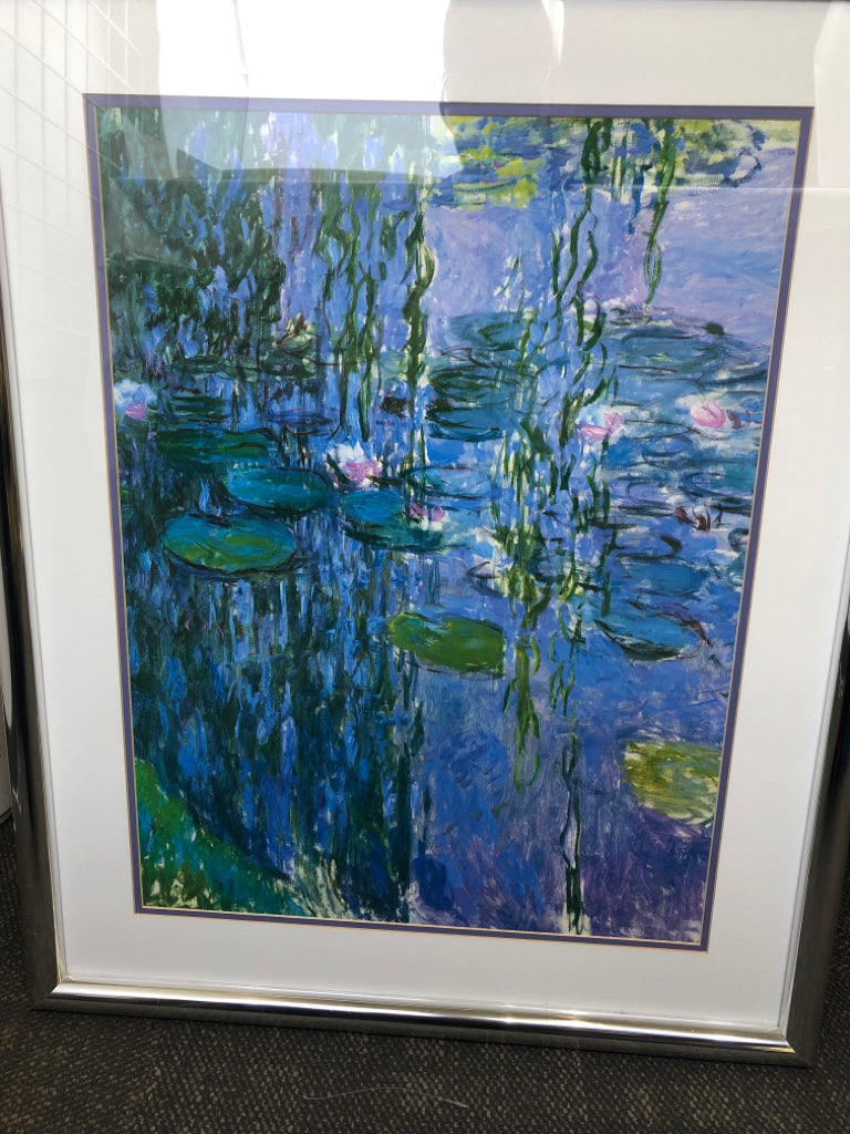 ABSTRACT LILY POND SCENE WALL HANGING IN SILVER FRAME.