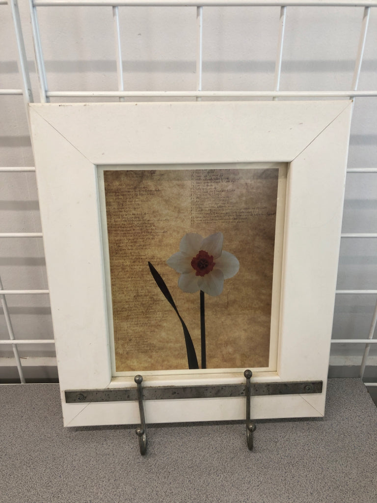 DAFFODIL IN WHITE DECORATIVE FRAME.