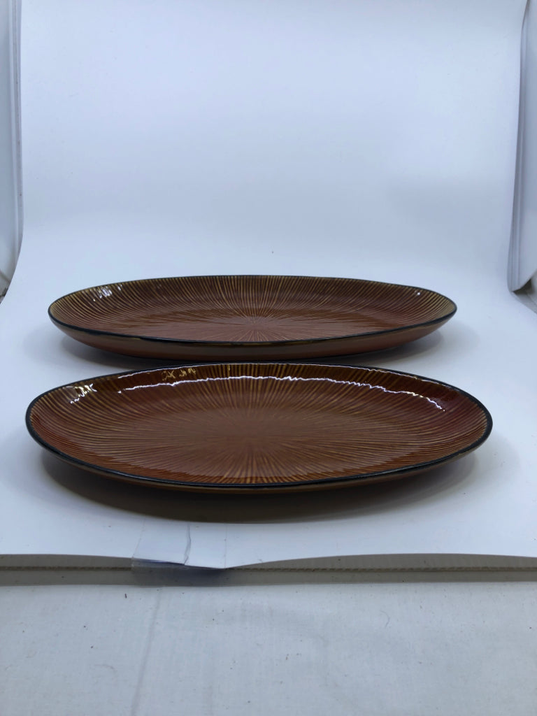 2 BROWN OVAL CERAMIC SERVING PLATES.