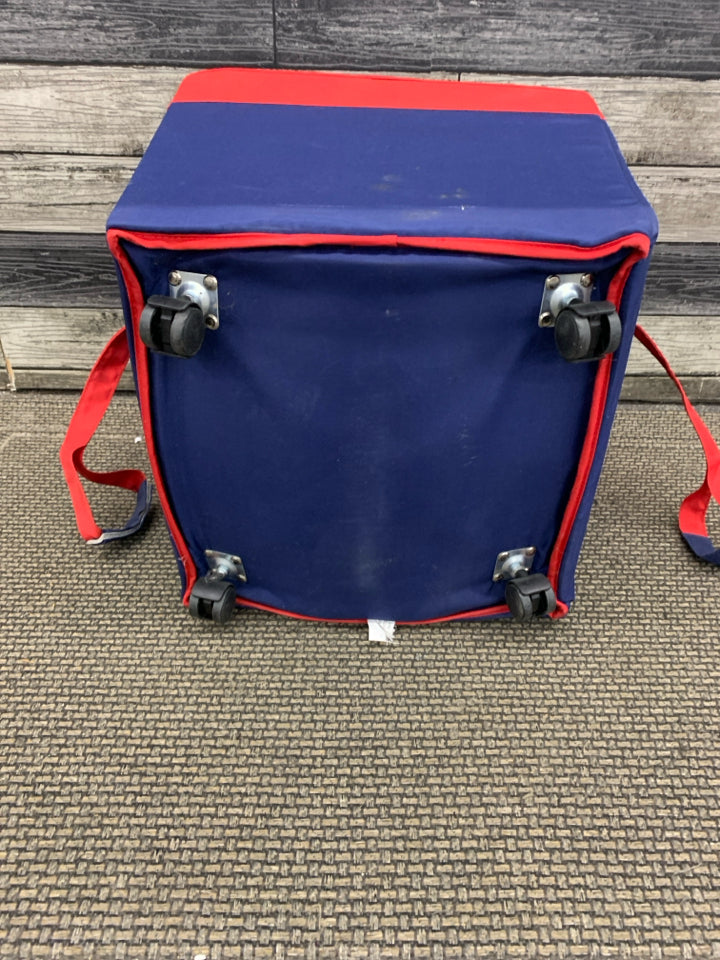 RED CLOTH STORAGE BIN W/WHEELS & HANDLE.