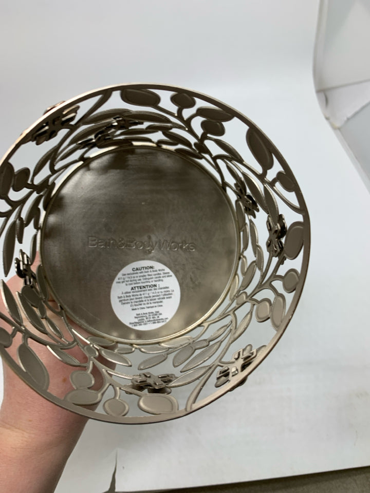 FOOTED SILVER METAL CANDLE CAGE.