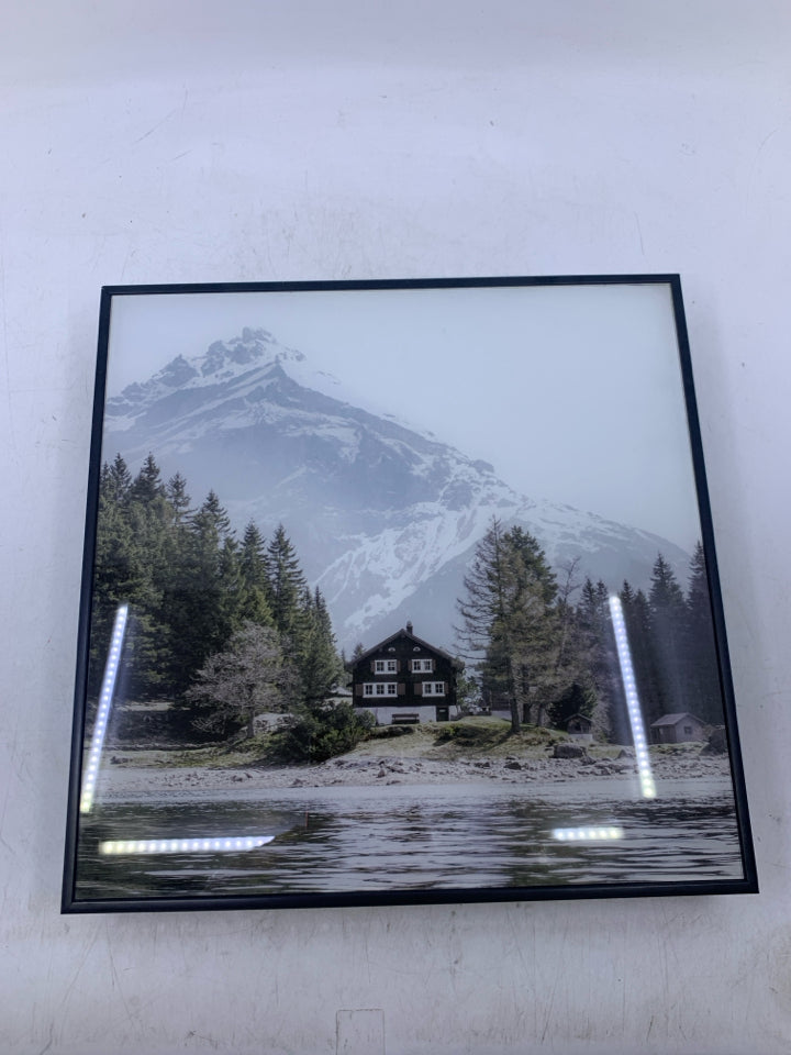 CABIN IN THE MOUNTAINS IN BLACK FRAME.