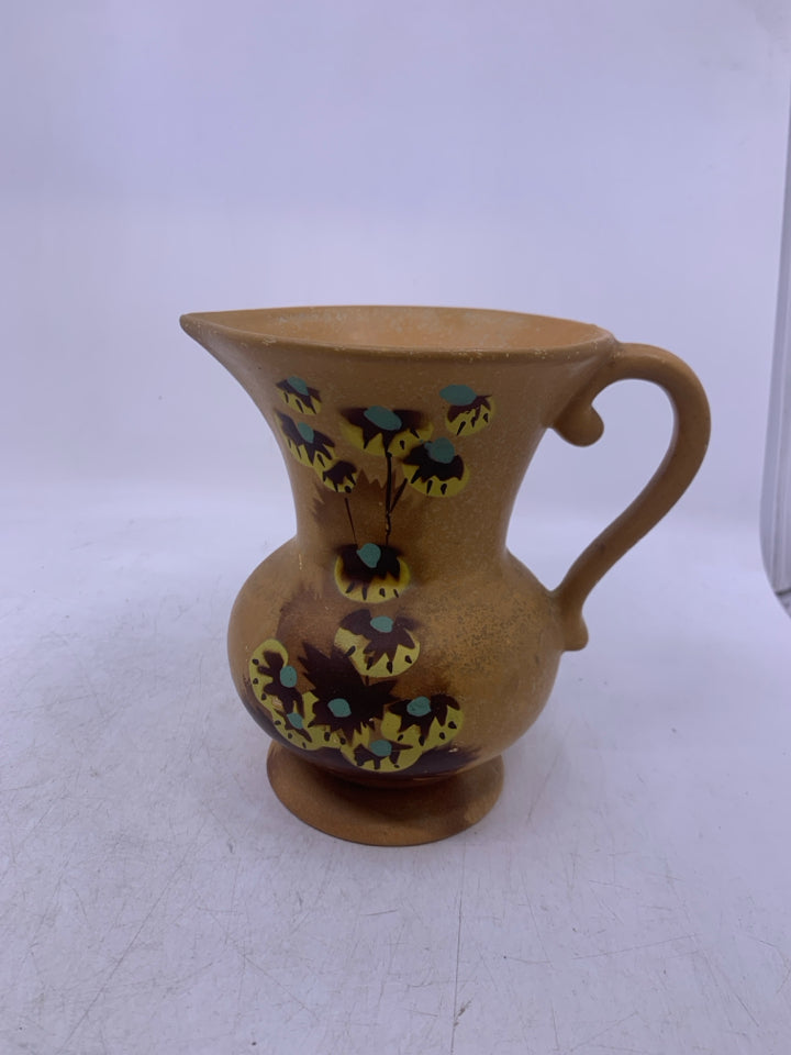 VTG FOOTED LIGHT ORANGE W/ DETAIL IN CENTER.