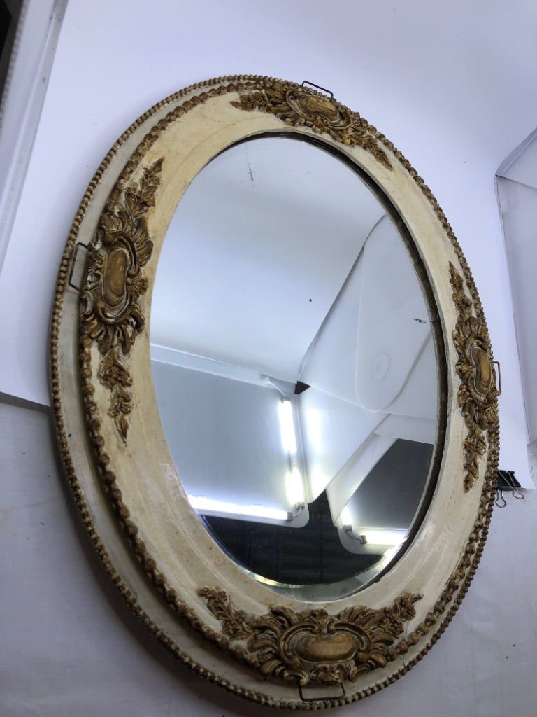 VTG GOLD/CREAM ORNATE OVAL MIRROR.