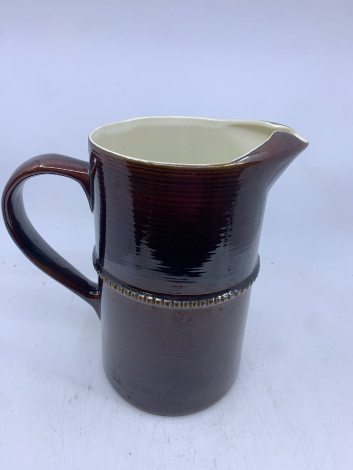 BROWN CERAMIC PITCHER.