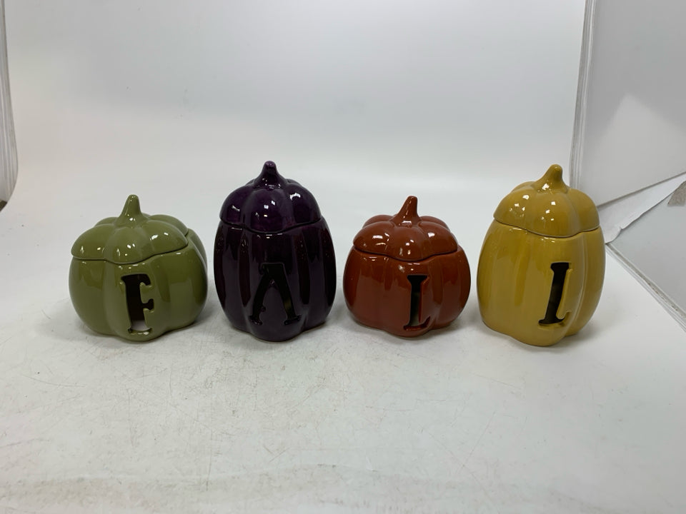 4 SMALL PUMPKIN TEA LIGHT HOLDERS SPELL OUT FALL.