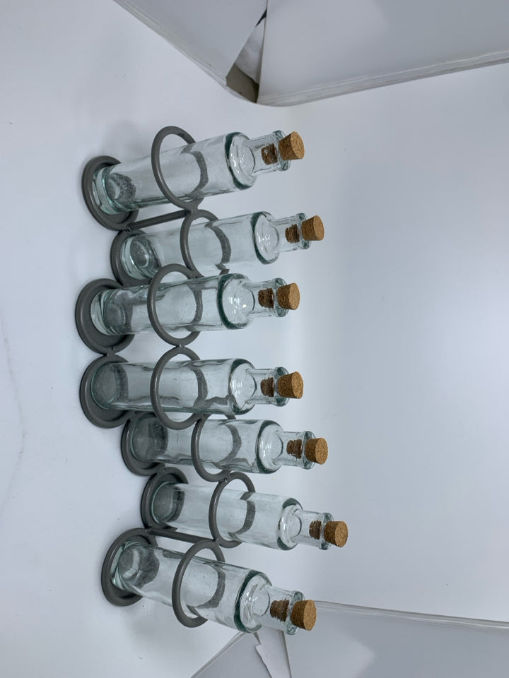 7 SLOT GREY METAL STAND W/ GLASS BOTTLES.