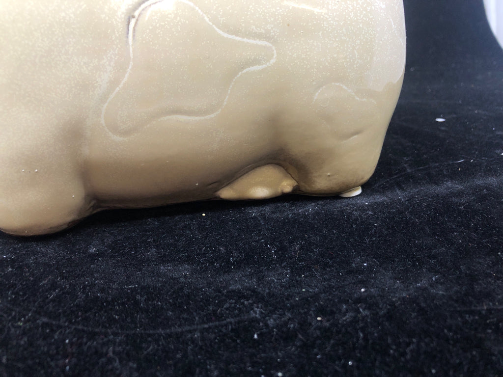 TAN CERAMIC COW.