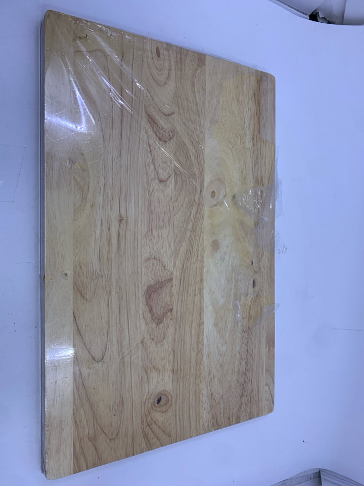 NIP WOOD CUTTING BOARD.