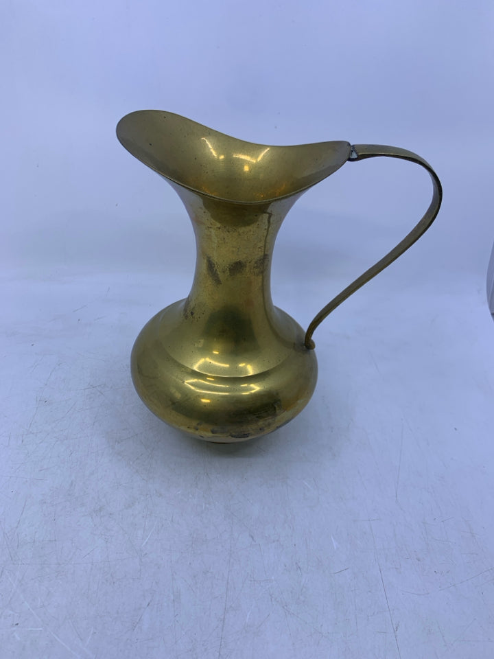 BRASS FOOTED PITCHER.