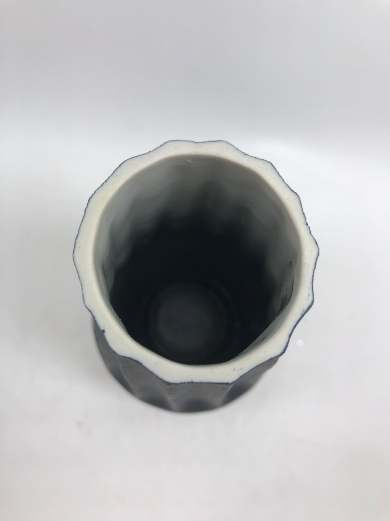 TALL CERAMIC BLUE DIAMOND SHAPED VASE.