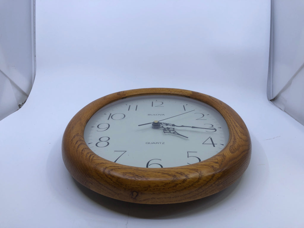 OVAL WOOD BULOVA CLOCK.
