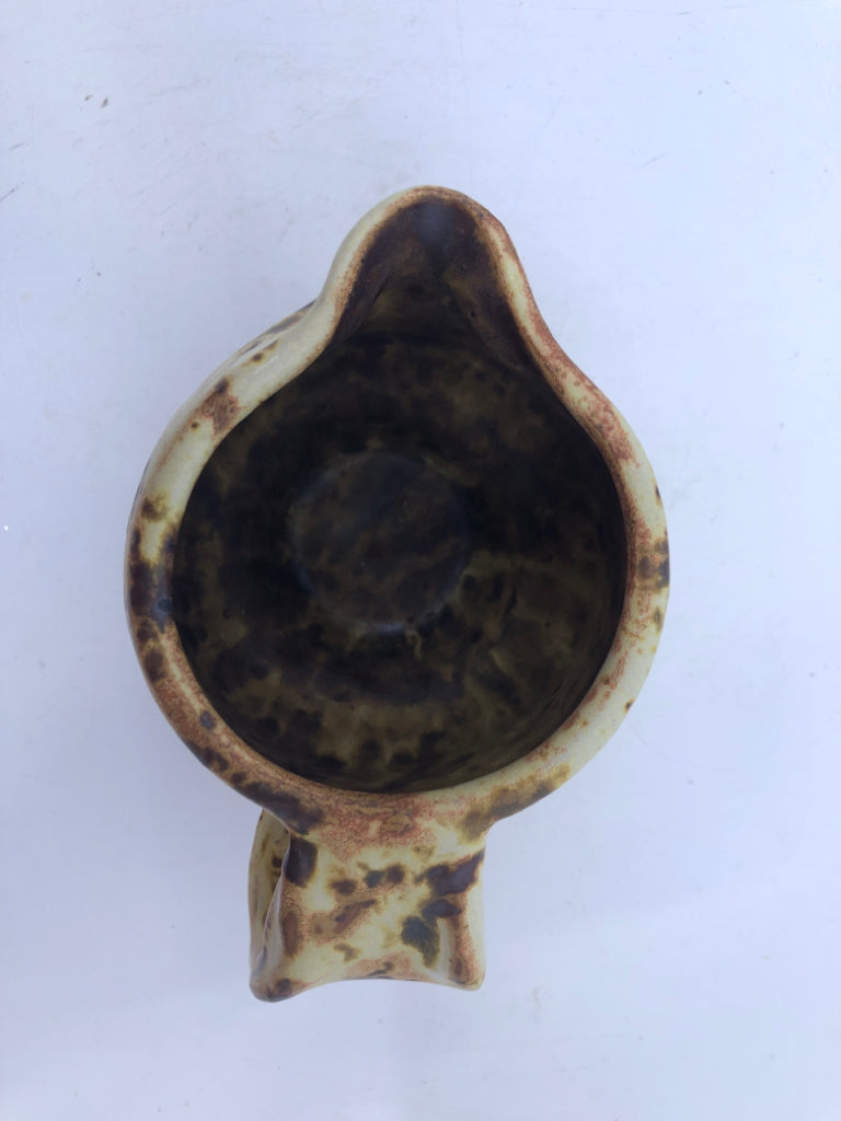 BROWN AND YELLOW COW PATTERN CREAMER.