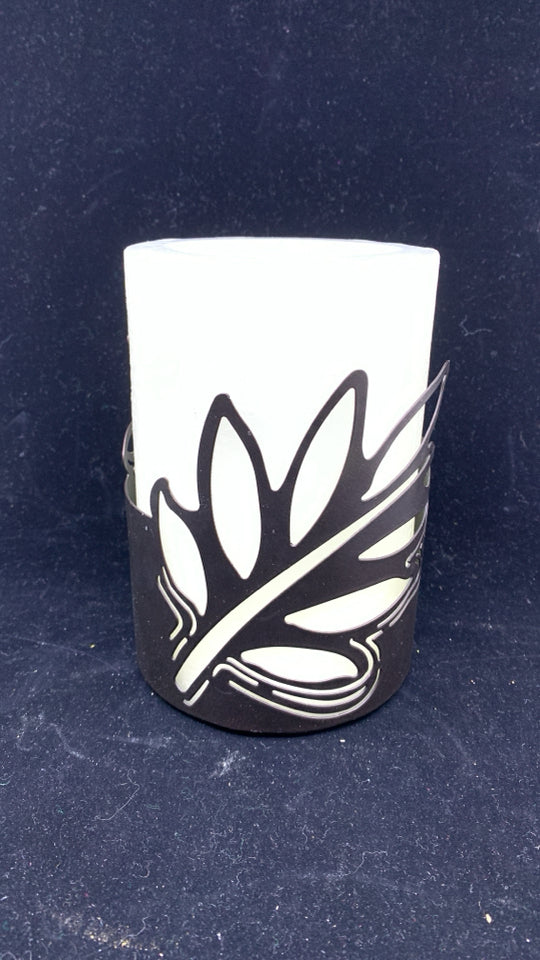 WHITE FAUX LIGHT UP CANDLE IN BROWN LEAF CANDLE HOLDER.
