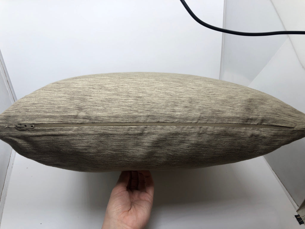 LIGHT BROWN FABRIC PILLOW.