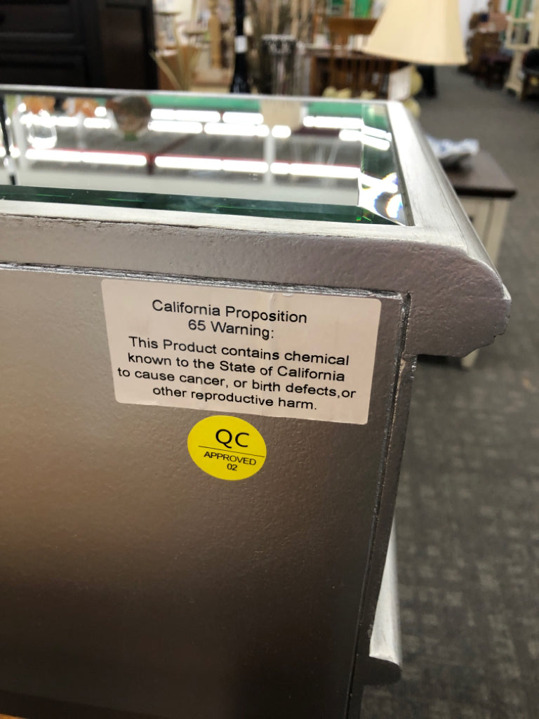 MIRRORED CONSOLE TABLE W/3 DRAWERS & 4 DOORS.