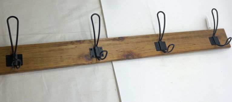 WOOD WALL ART W/ 4 BLACK METAL HOOKS.