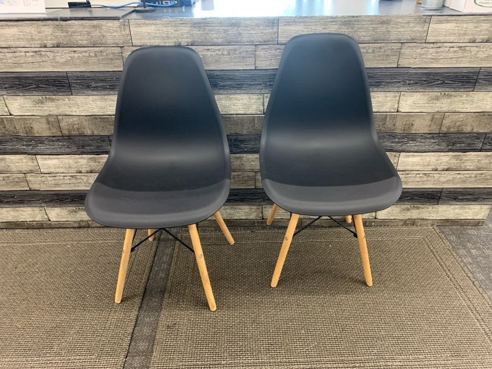 2 DARK GREY PLASTIC CHAIRS W/ WOOD LEGS.