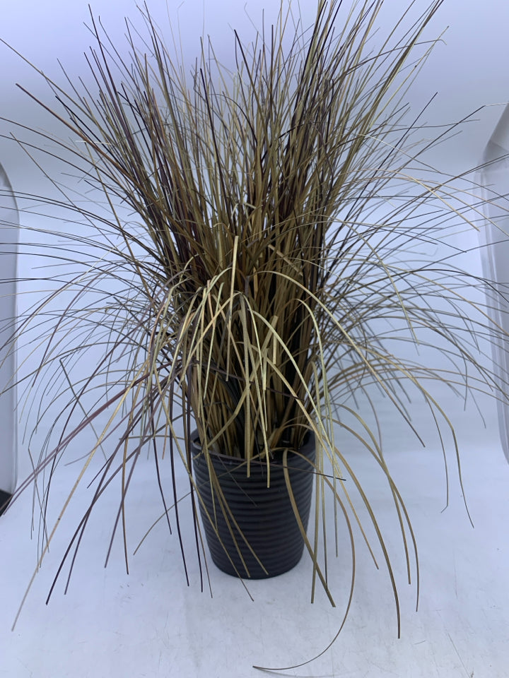 FAUX DRIED GRASS IN RED BROWN PLANTER.