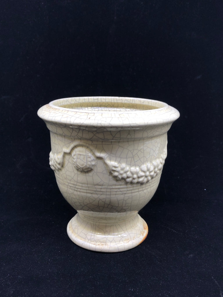 CREAM CRACKLE URN SHAPED VASE W EMBOSSED PATTERN.