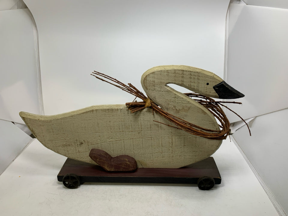 LARGE WOOD GOOSE ON WHEELS W/ TWIG GARLAND AROUND NECK.