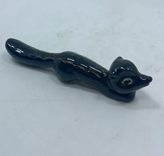 SM CERAMIC BLACK SKUNK FIGURINE.